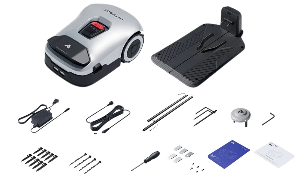 Obsah balení robotické sekačky Anthbot Genie – nabíjecí stanice, kolíky, kabel a příslušenství
